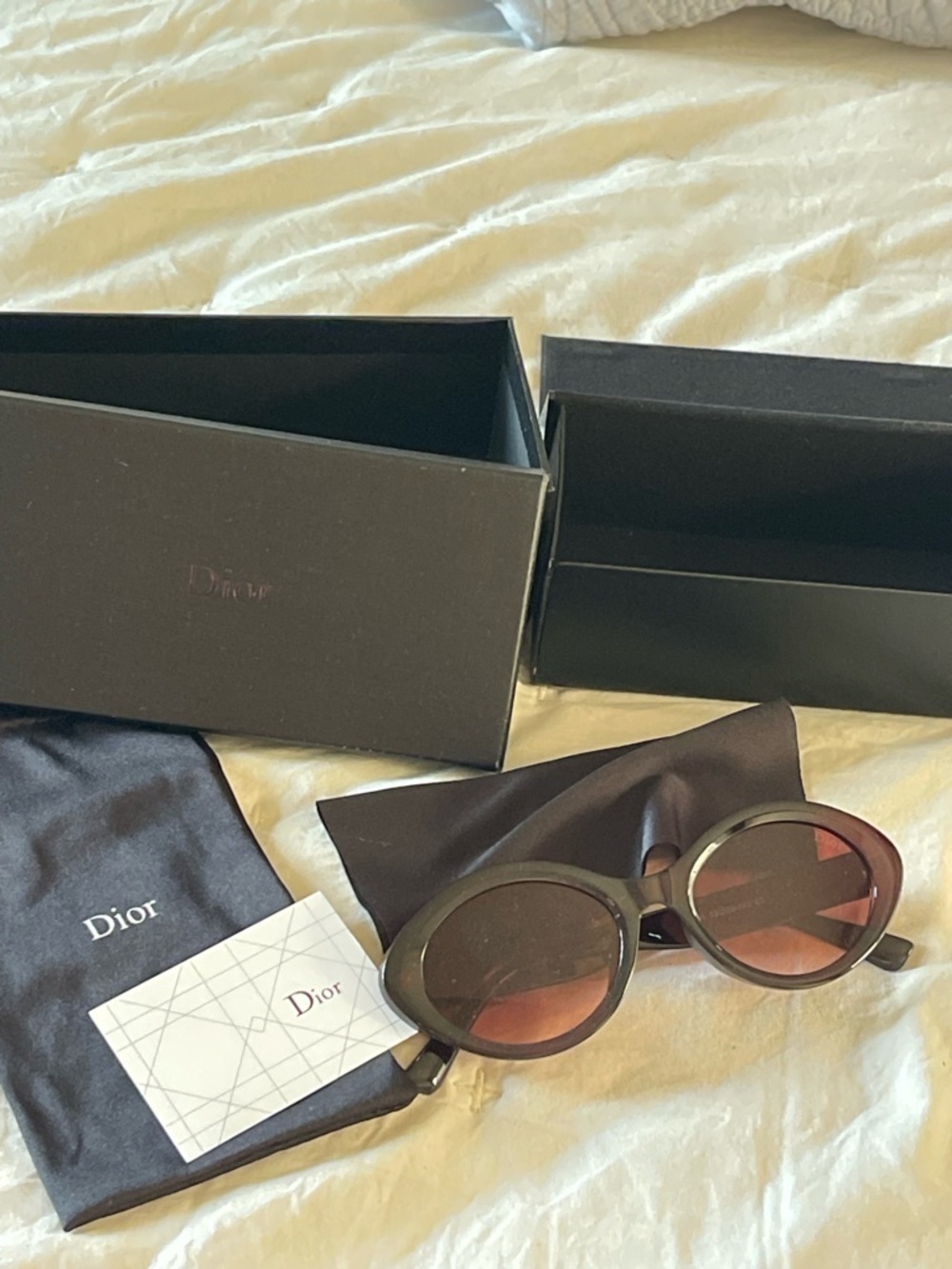 Dior Classic oval shape made from polished black acetate. Sunglasses